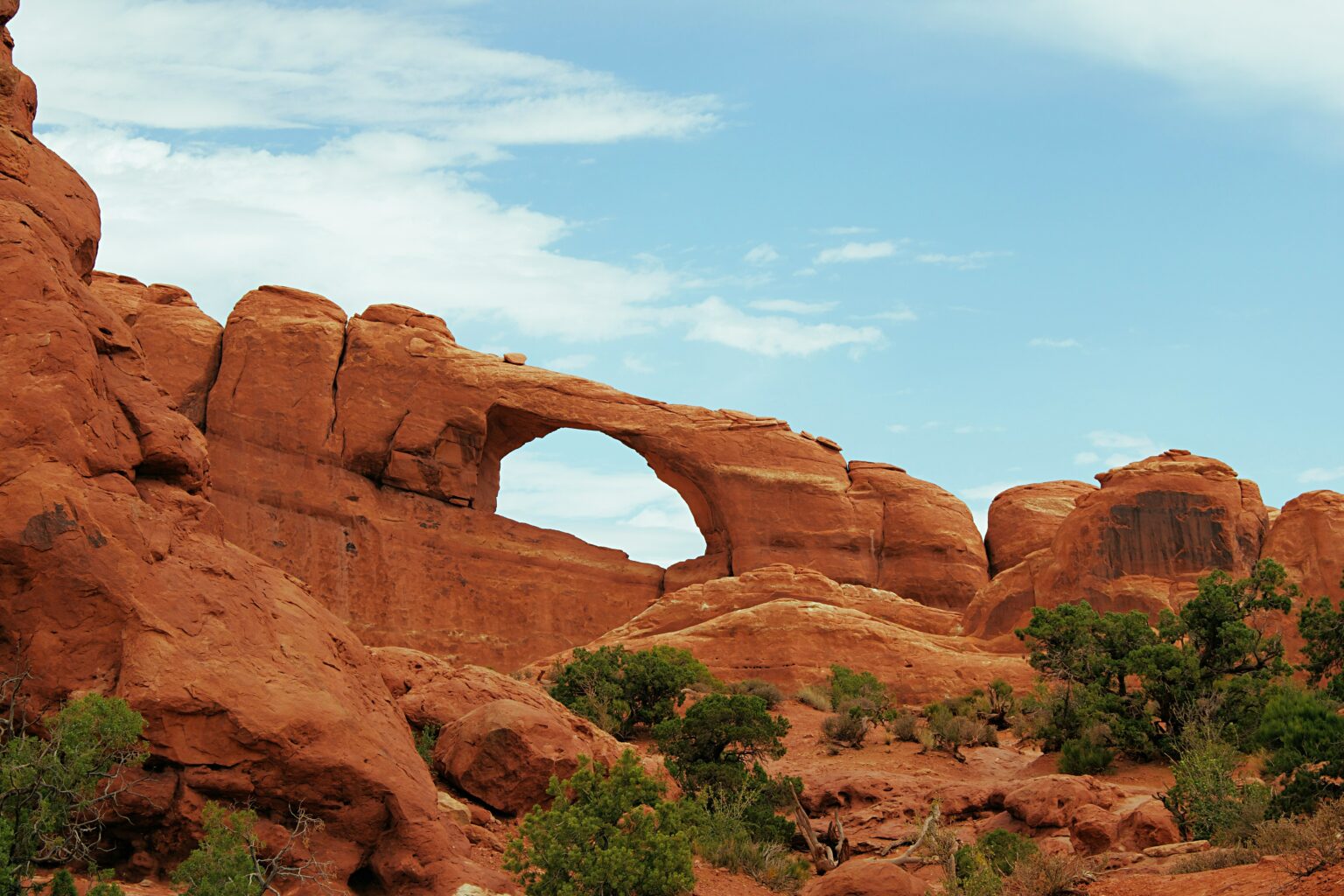 Arch in Arches National Park with blue sky
