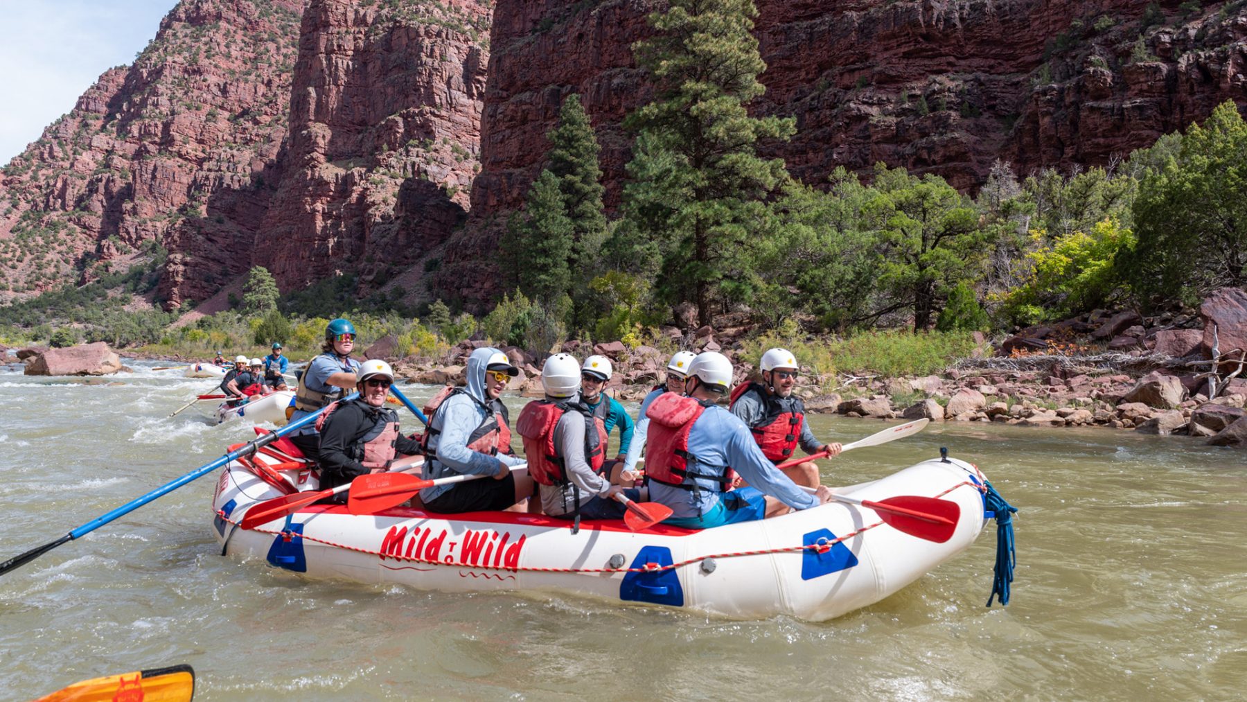 medium shot of boat full of guestsrafting in Gates of Lodore - Green River
