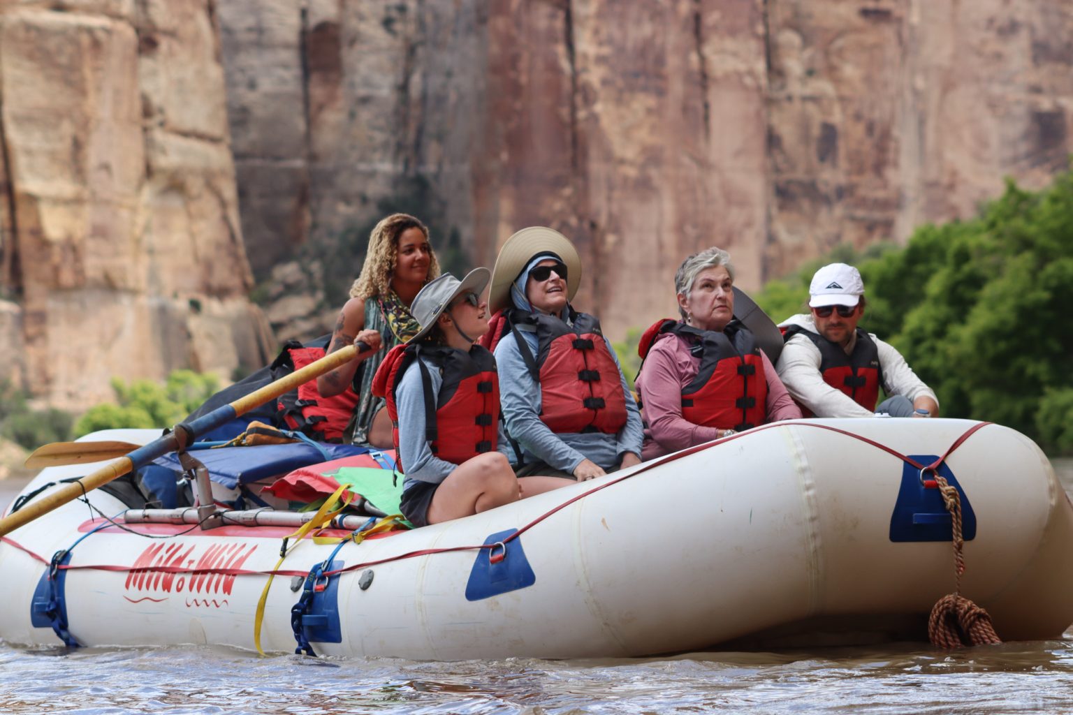 Raft with family and guide going down the Yampa River