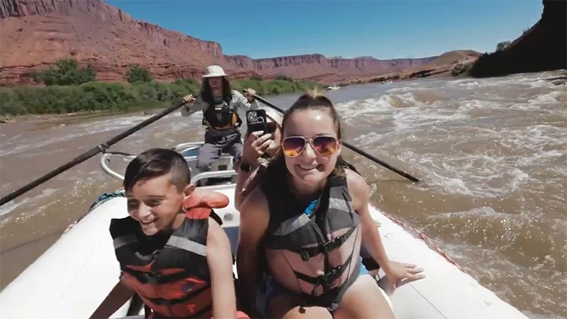 A woman and boy are the focus during this rafting adventure in Moab