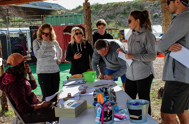 A group fills out paperwork before rafting in Salt River