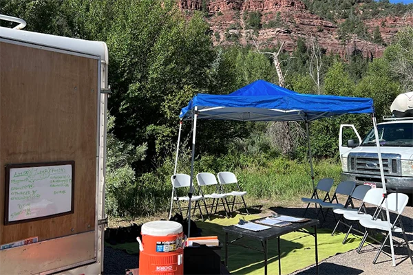 a table and tent are set up at the Telluride outpost