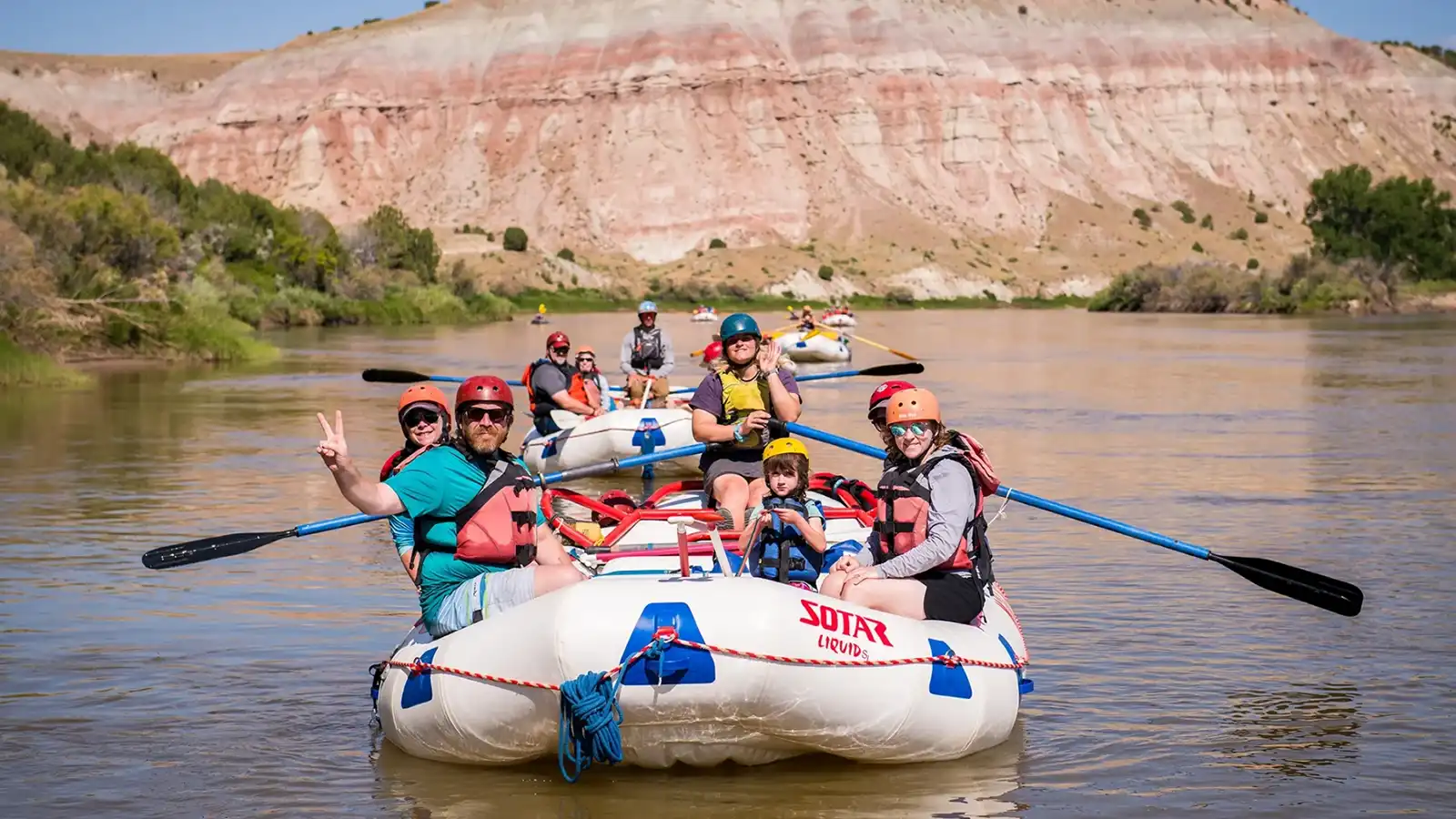 Upper Colorado River Rafting -Scenic shot of canyon with smiling guests on raft