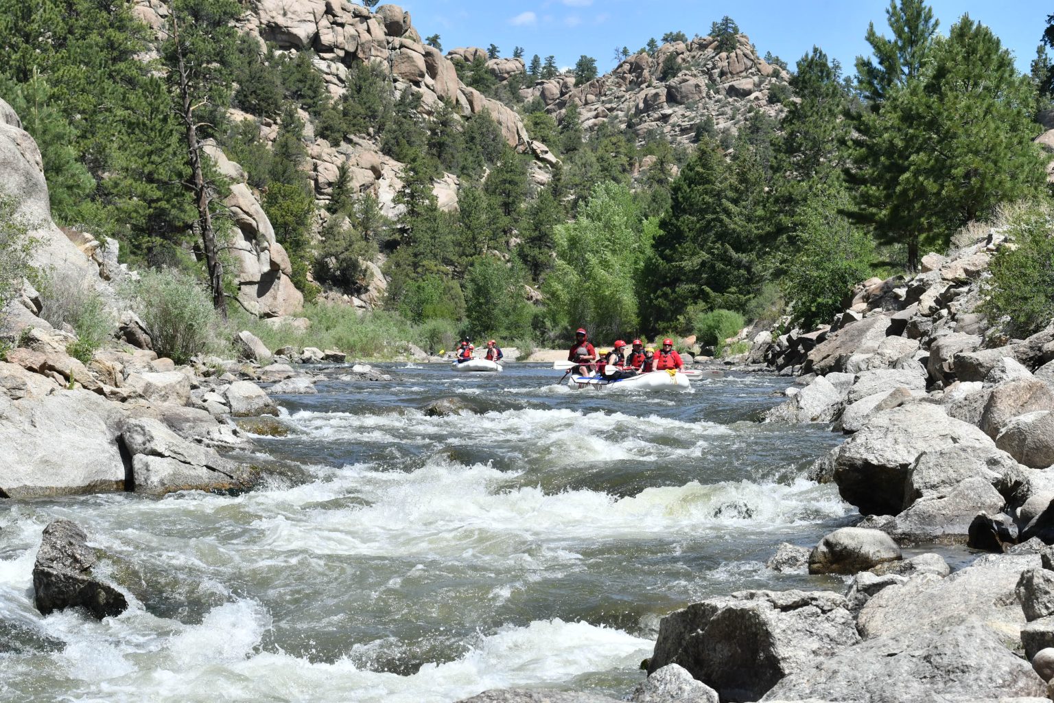 Wide view of Browns Canyon - whitewater rapids and raft paddling through