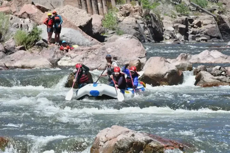 Sunny day scouting the Royal Gorge - paddling rafting through whitewater in foreground
