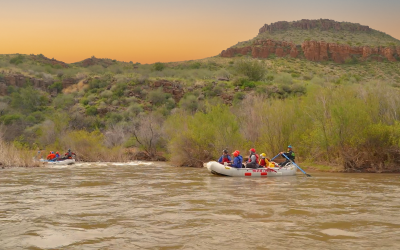 Salt river daily trip - wide shot of raft with guests and desert scenery