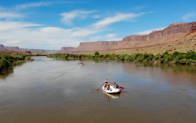 wide shot of castle valley with a raft - colorado river - multi-day rafting trip