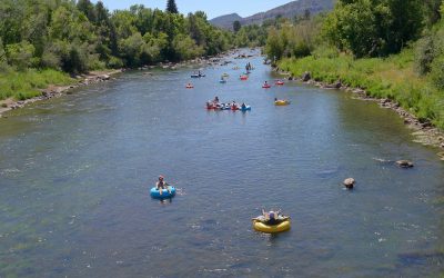 Wide shot of tubers going down the lower animas - mild to wild rentals