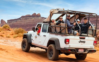 driver and Guests in jeep gladiator smiling at camera in moab desert - Mild to Wild