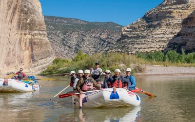 Group on raft in front of Echo wall in gates of Lodore - Dinosaur National Monument - Corporate Retreat - Mild to Wild Rafting